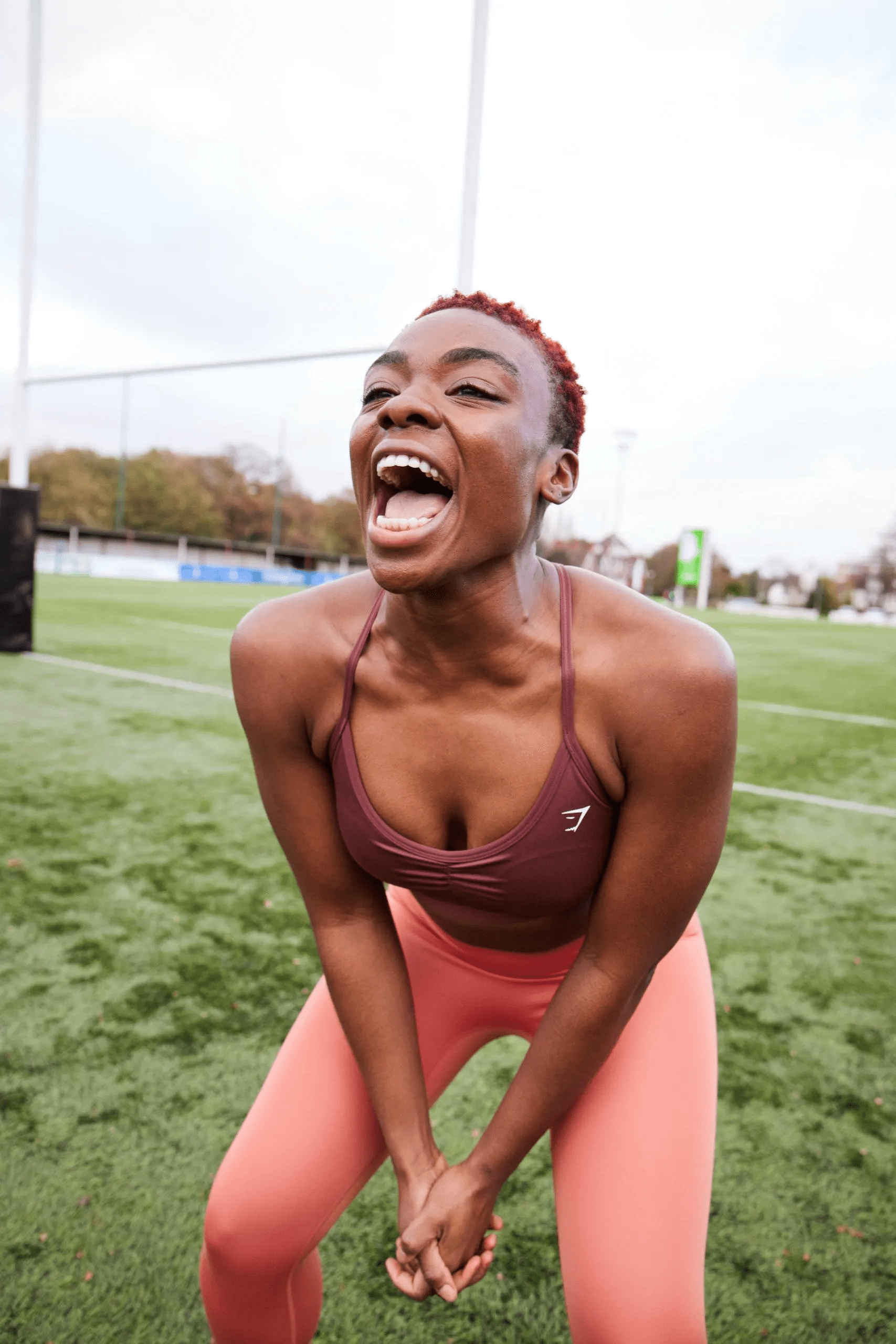 image of an athlete laughing whilst working out