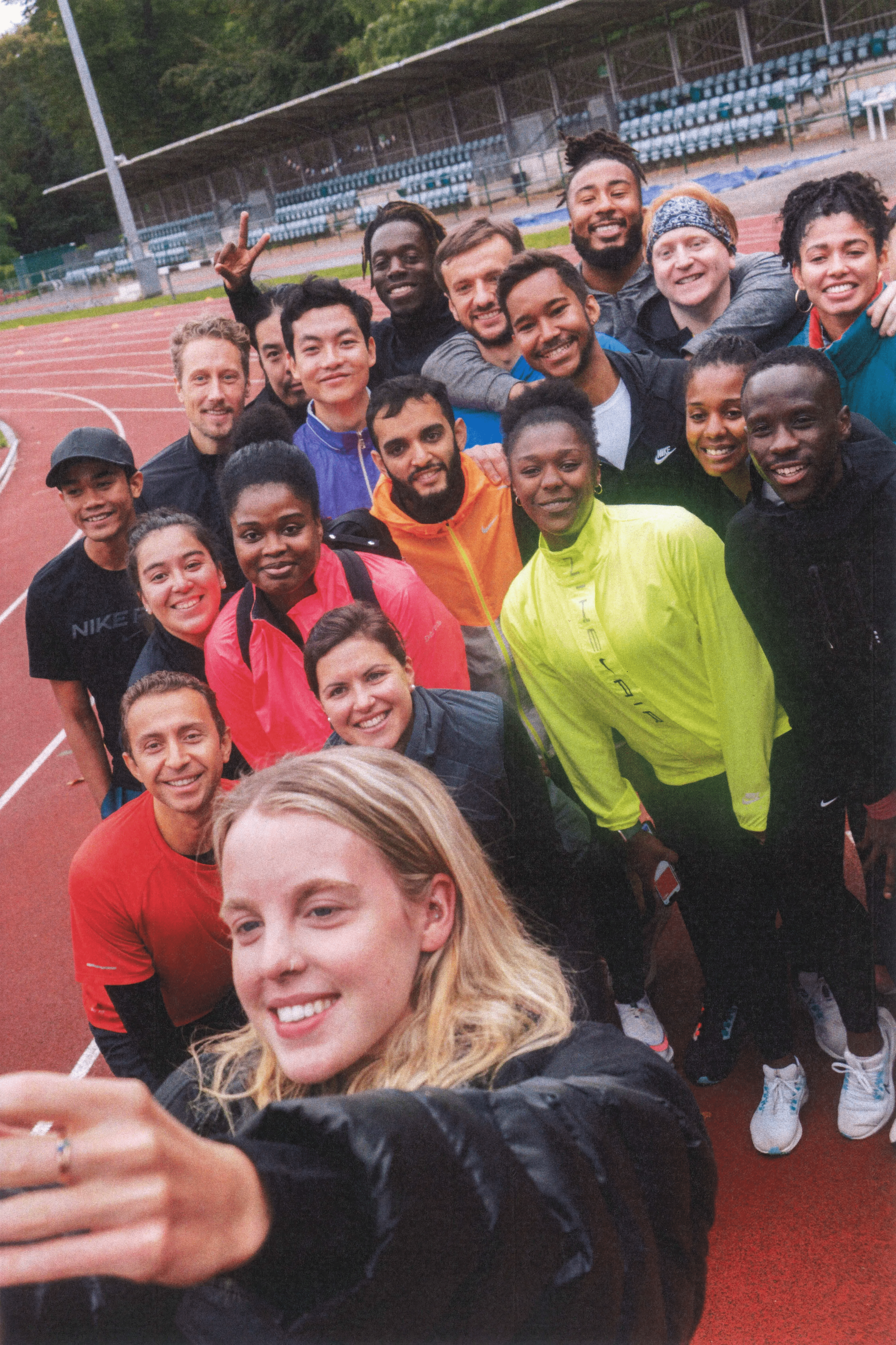members posing for a selfie with olympic runner Keely