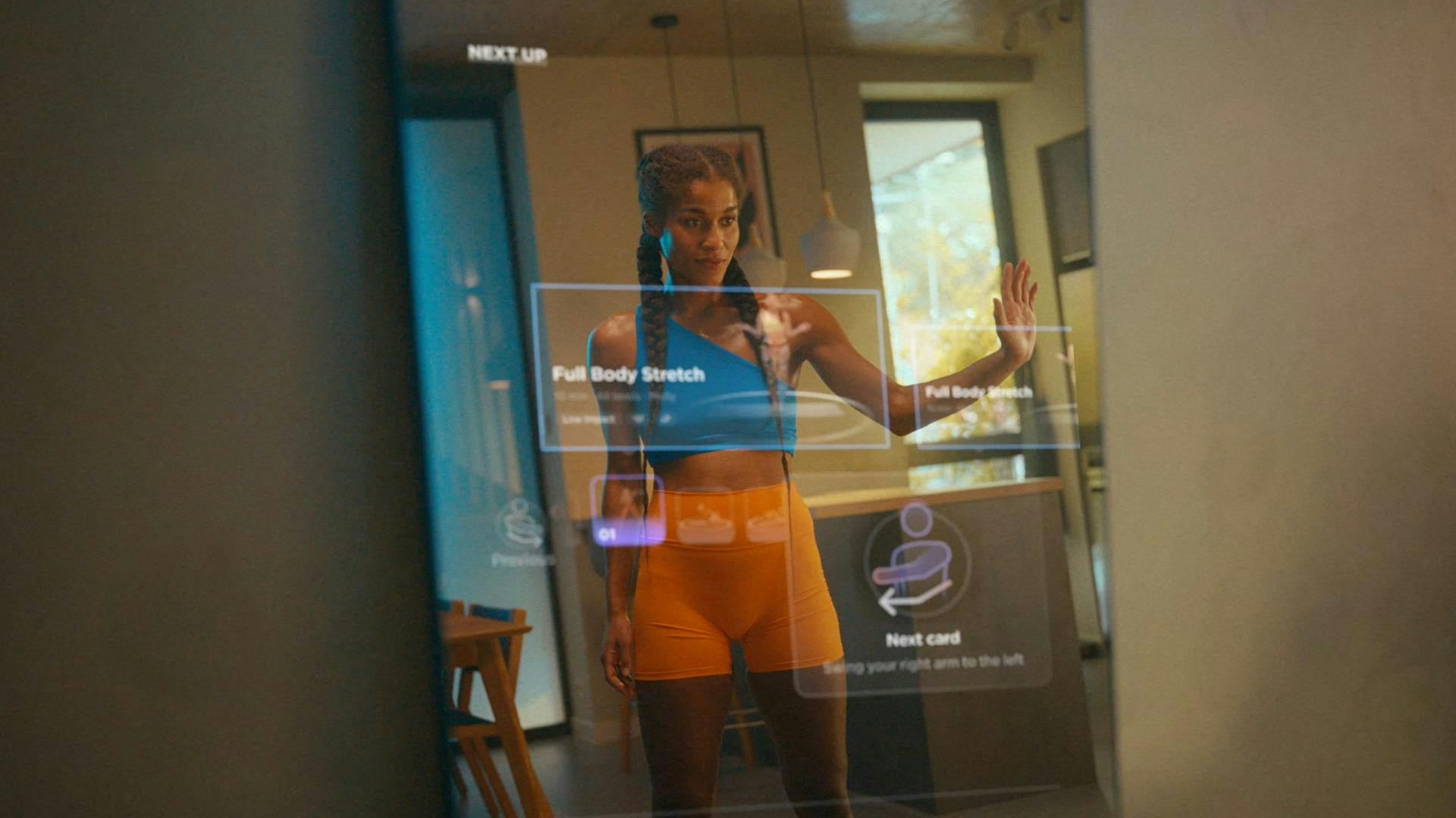 woman using exercise mirror in her home